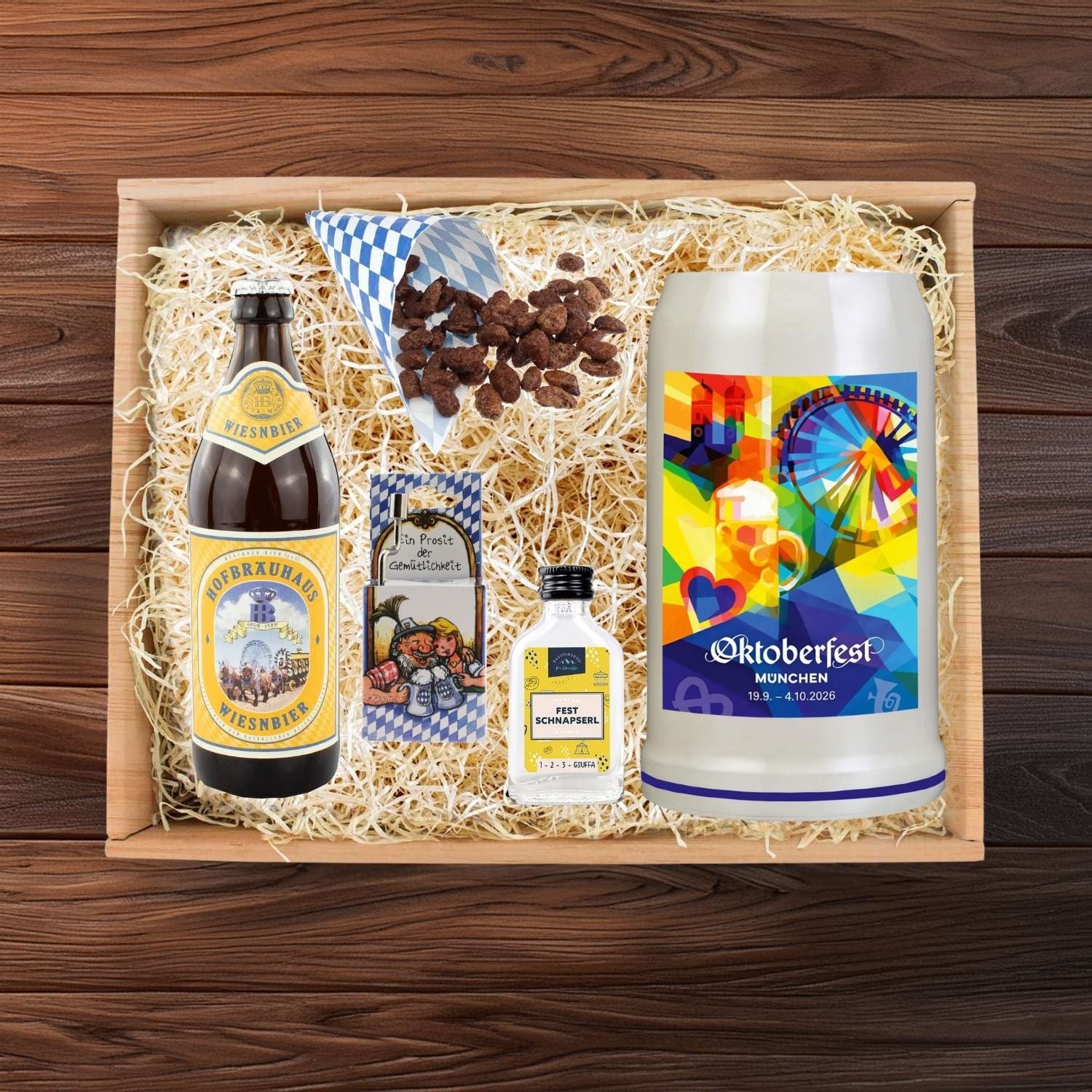 Oktoberfest Geschenkbox mit Wiesnbier, farbenfrohem Maßkrug, gebrannten Mandeln und Schnaps.