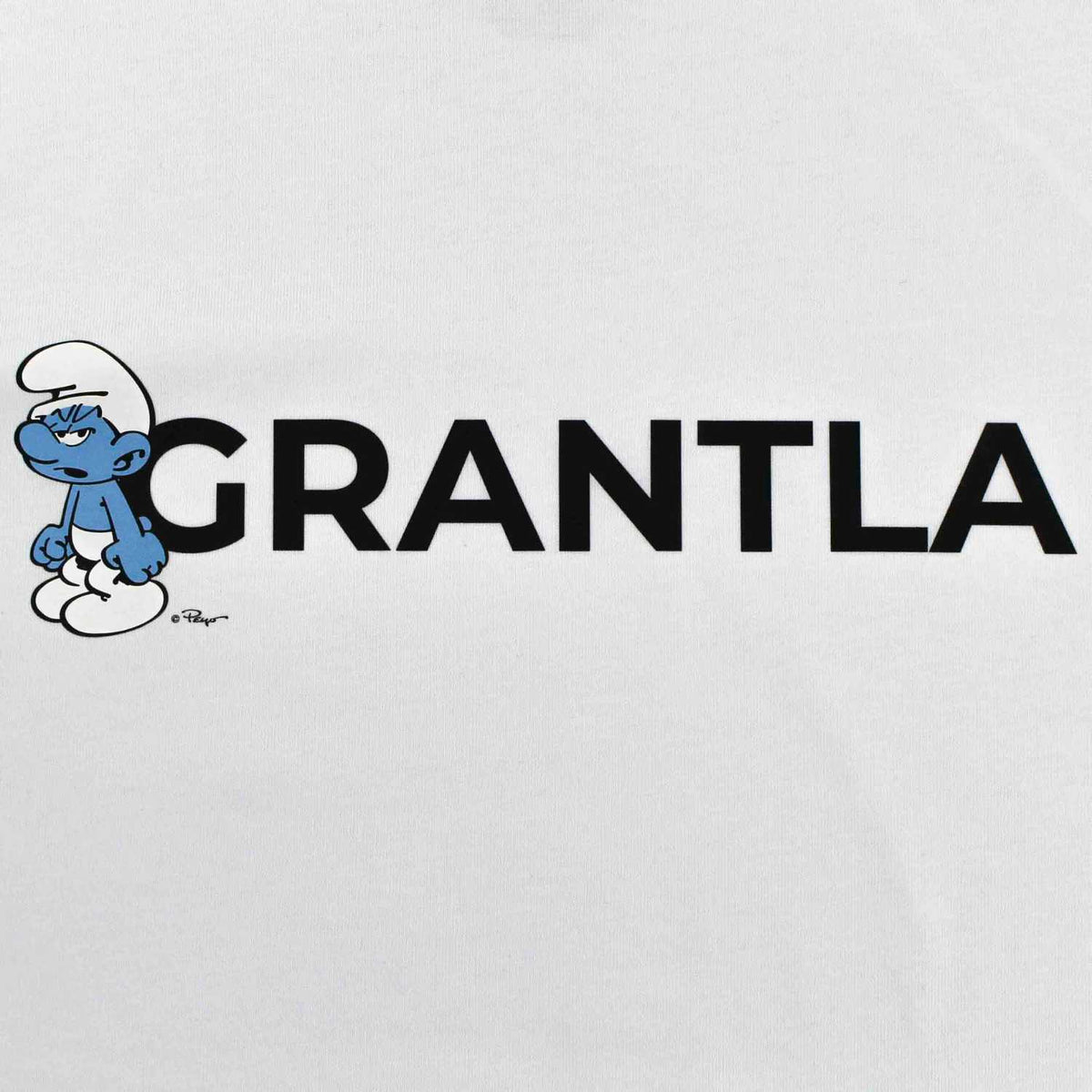 Schlümpfe Damen T-Shirt Grantla, Weiß mit mürrischem Schlumpf und schwarzem Grantla-Schriftzug.