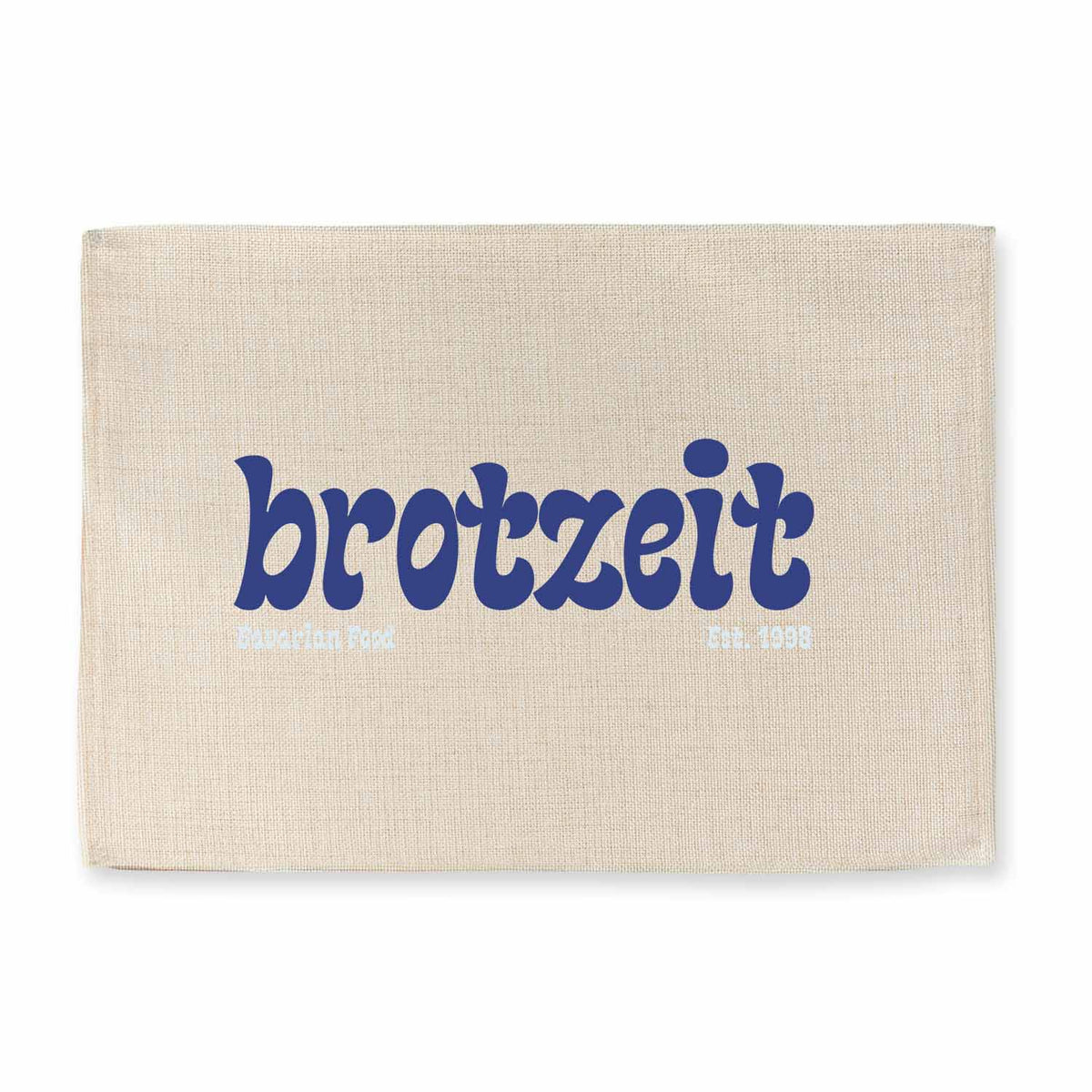 Tischset Brotzeit est. 1998 in Leinenoptik mit dunkelblauem Schriftzug auf hellem Hintergrund.