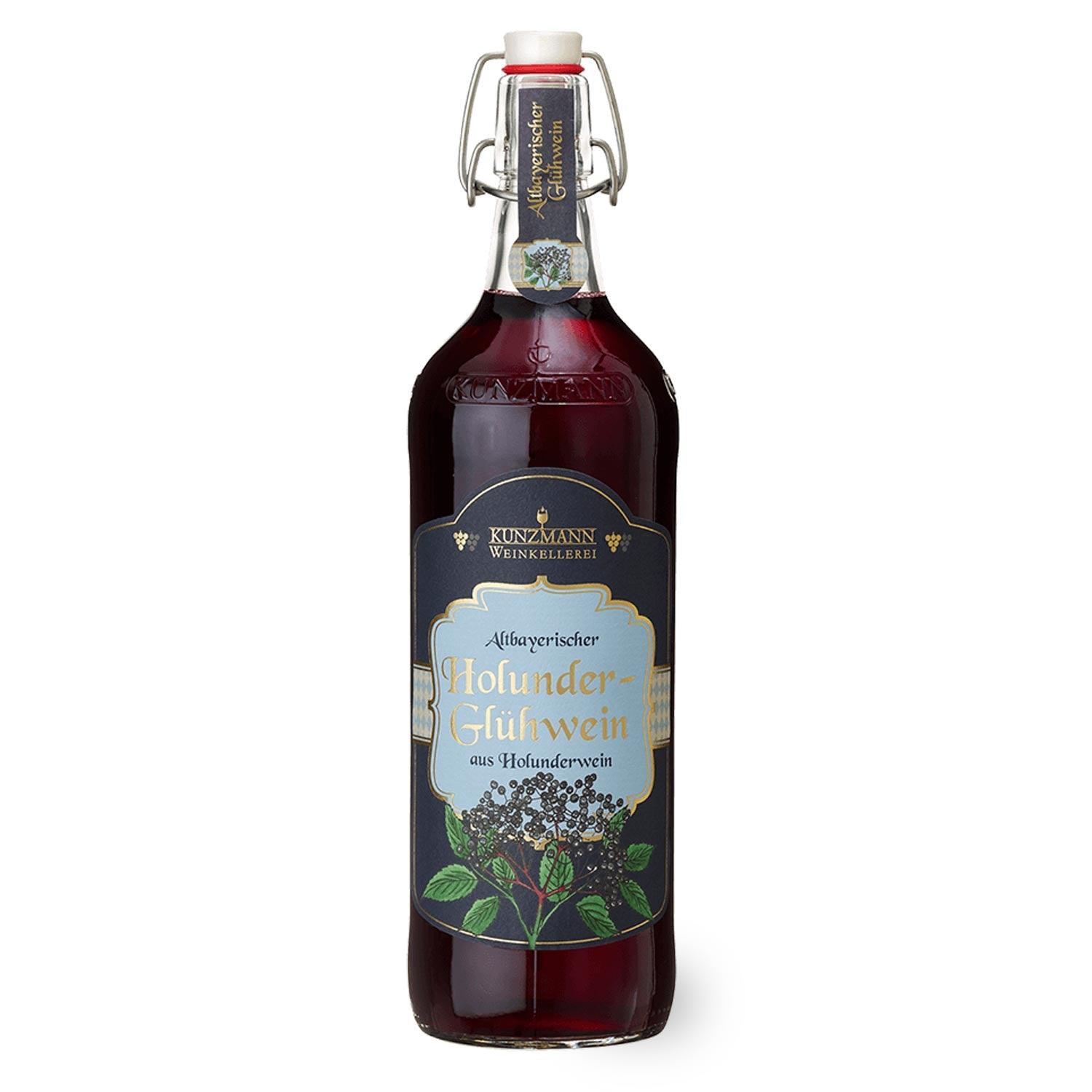 Weihnachtsbox Christkindl: Flasche Holunderglühwein mit Bügelverschluss, dunklem Etikett und Beerenmotiv.