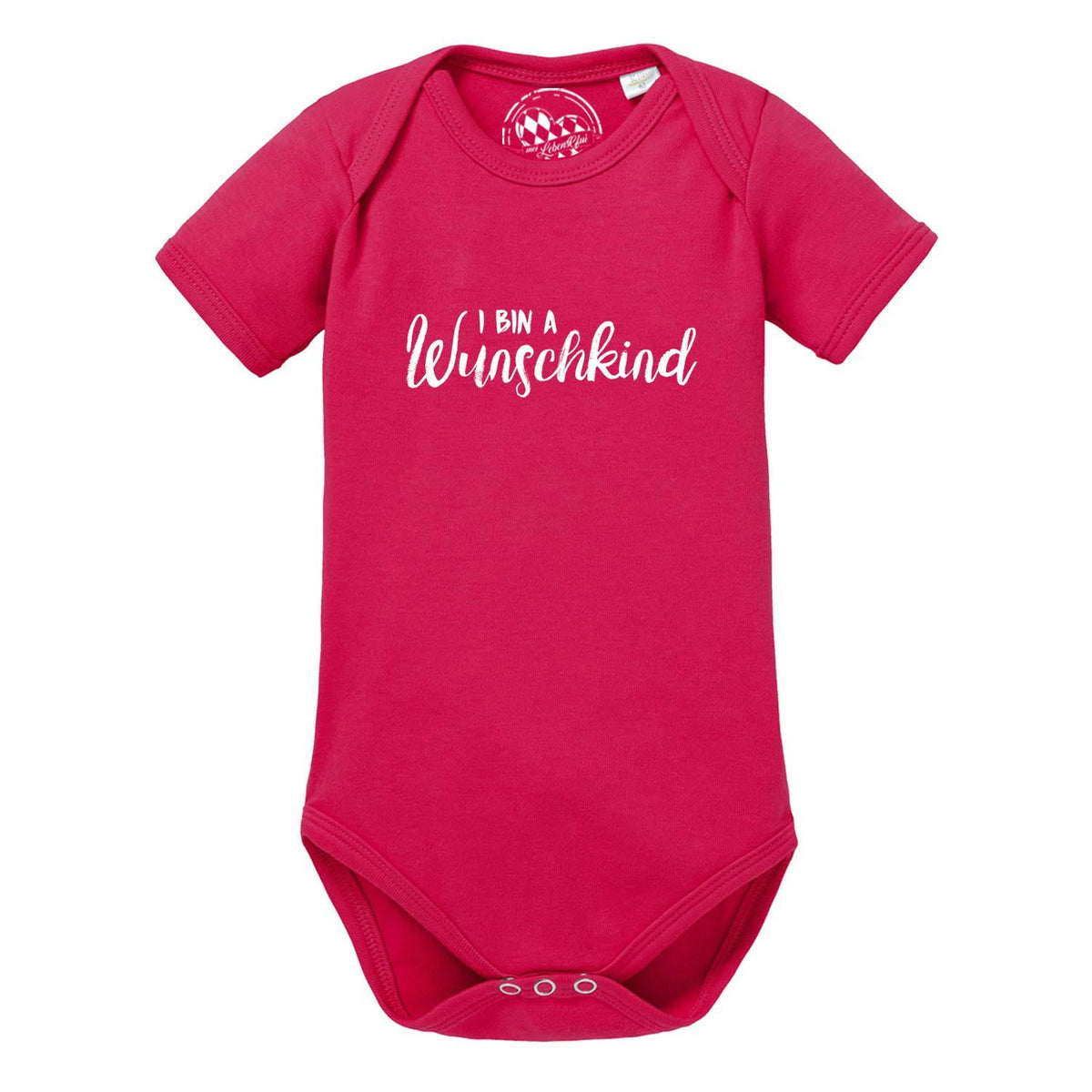 Pinkfarbener Baby Body Wunschkind mit kurzem Arm und weißem Schriftzug, Druckknöpfe im Schritt.