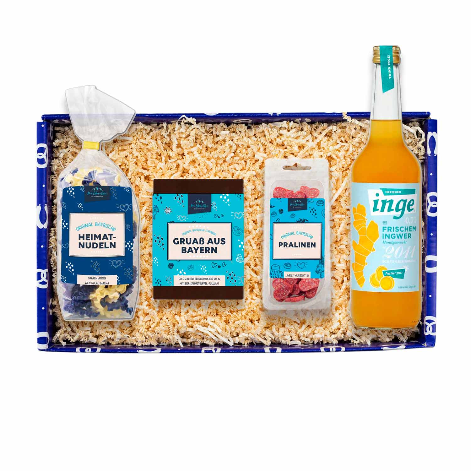 Geschenkbox Weiber-Schmankerl mit bayerischen Nudeln, Pralinen, Schokolade und Ingwergetränk, blau dekoriert.