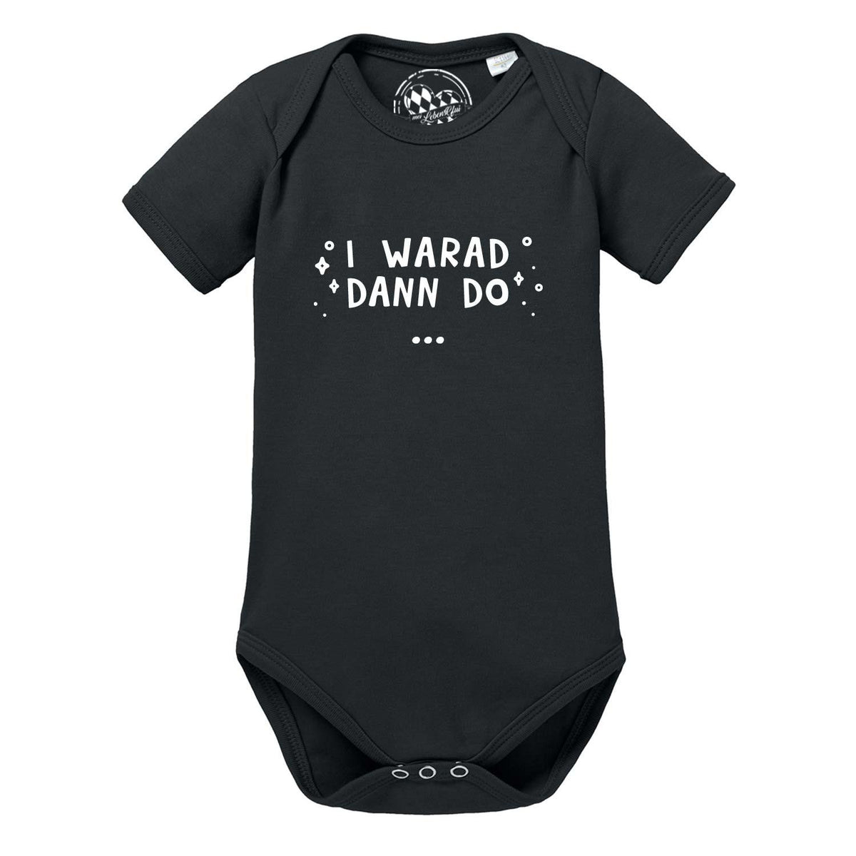 Schwarzer Baby Body "I warad dann do" mit weißem Spruch und kleinen Sternchen für Neugeborene.