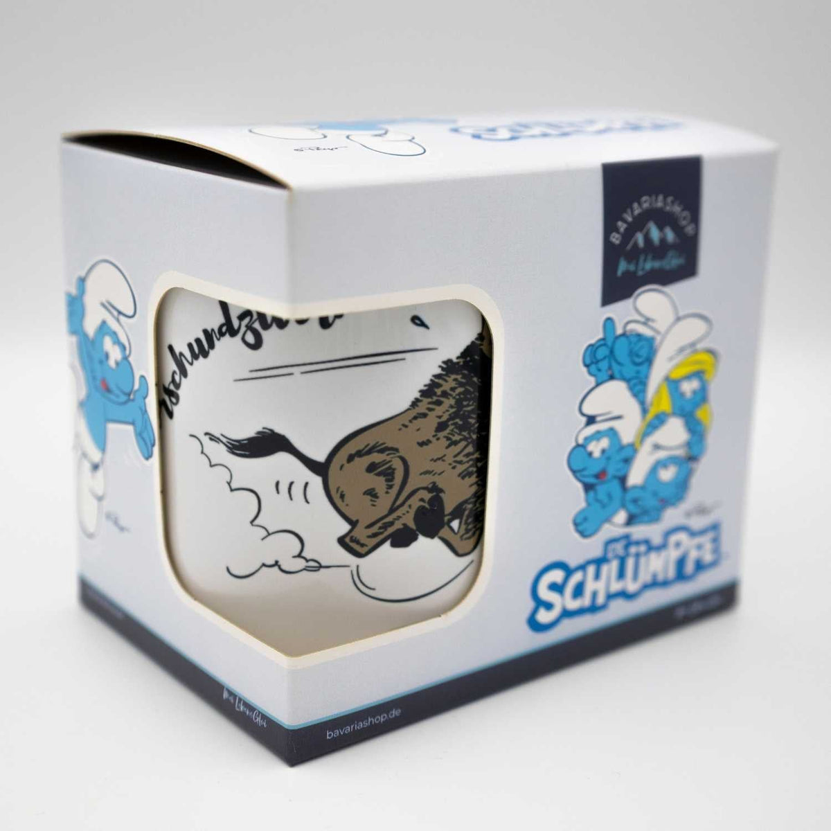 Emailletasse Die Schlümpfe Himmeorschundzwirn in Originalverpackung mit Abbildung eines bayerischen Stiers.