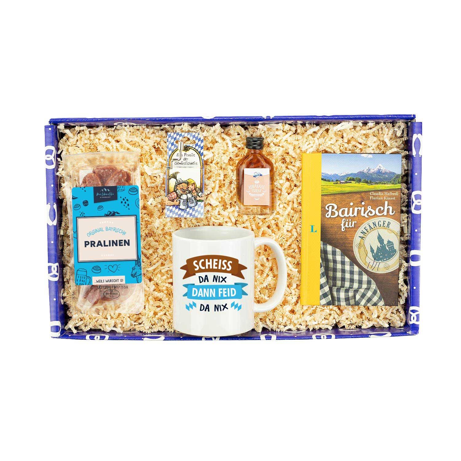 Geschenkbox Für Zuagroaste mit bayerischen Pralinen, Spruch-Tasse, "Bairisch für Anfänger" Buch und Likör.