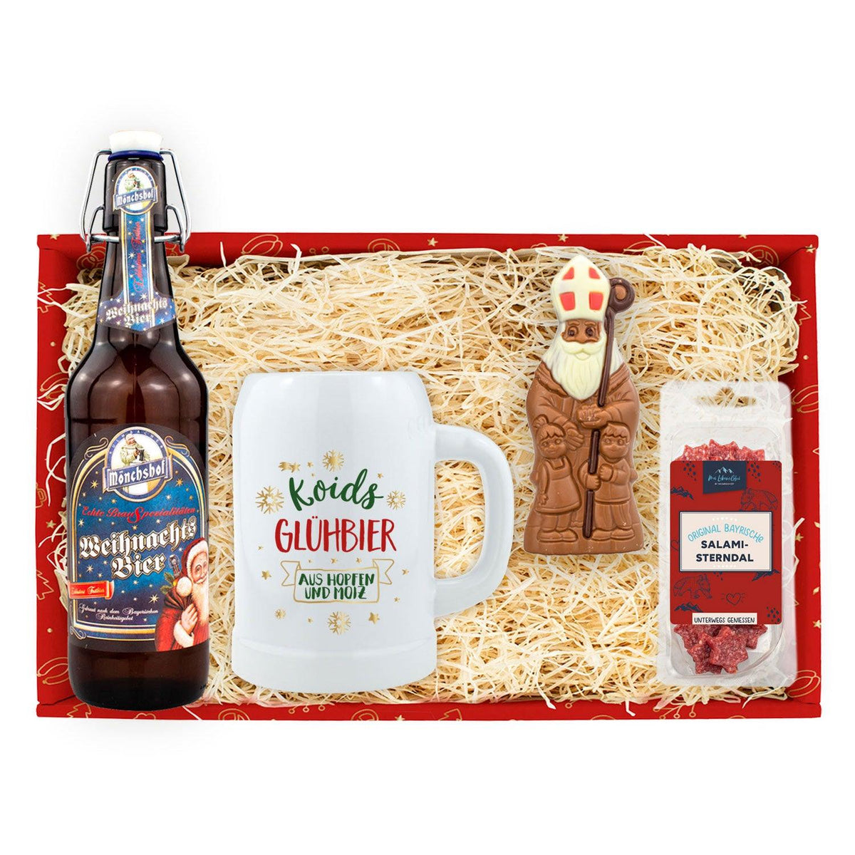 Weihnachtsbox Koids Glüh-Bier mit Flasche Weihnachtsbier, bedrucktem Krug, Schokoladen-Nikolaus und Salami-Sterndal in Holzwolle.