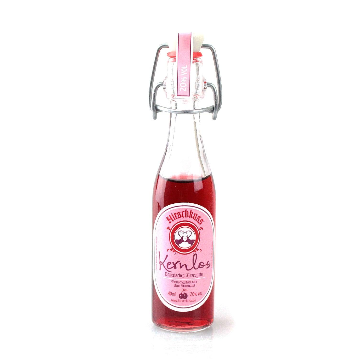 Kleine Flasche Hirschkuss Zwetschgenlikör 40ml mit 20% Vol und Bügelverschluss, pinkes Etikett.