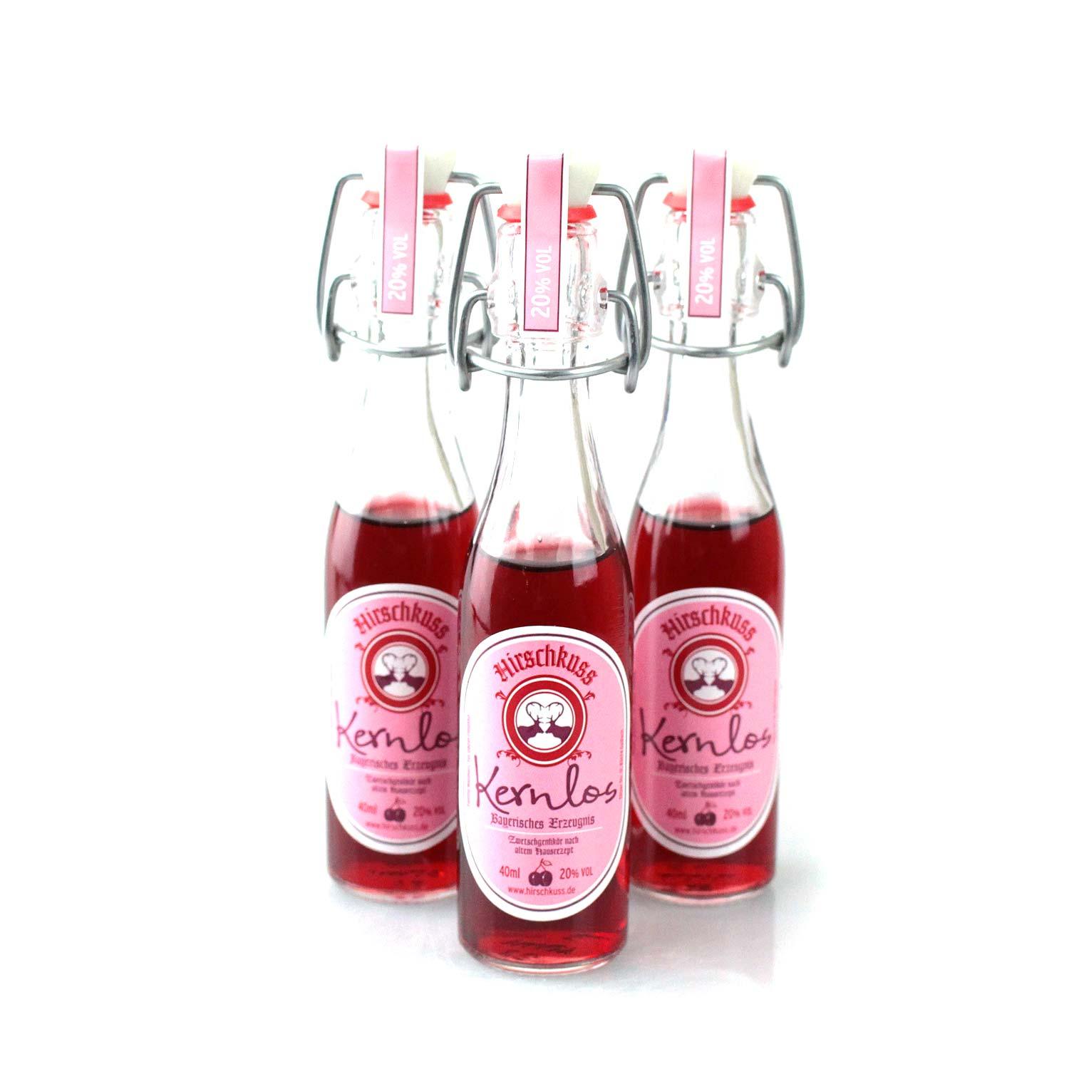 Drei Hirschkuss Kernlos Likörflaschen 40ml mit Bügelverschluss und rosa Etikett, bayerischer Kirschlikör.
