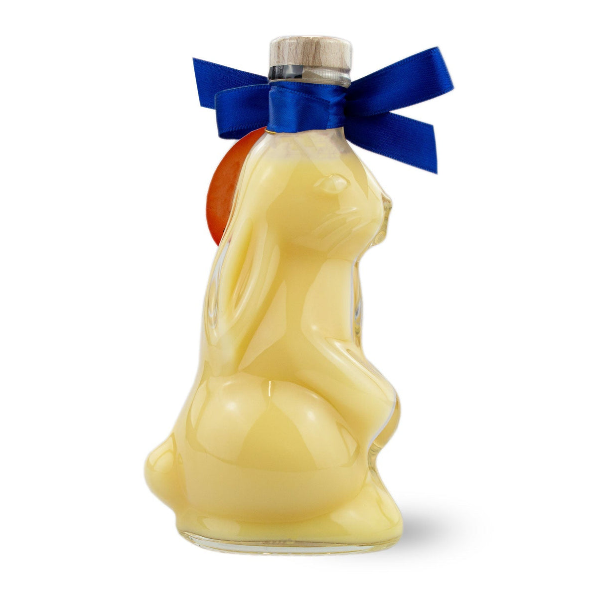 Osterhasen Eierlikör in Hasenform Flasche mit gelbem Inhalt, blauem Band und Holzverschluss.