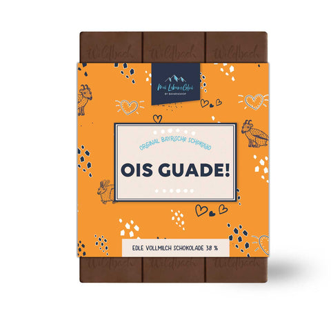 Edle Vollmilch Schokolade "Ois Guade!" mit orangefarbener Verpackung und bayerischen Motiven.