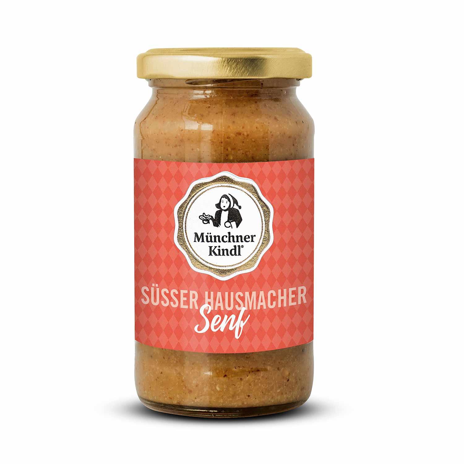 Ein Glas Süsser Hausmacher Senf BIO mit rotem Etikett und goldenem Deckel auf weißem Hintergrund.