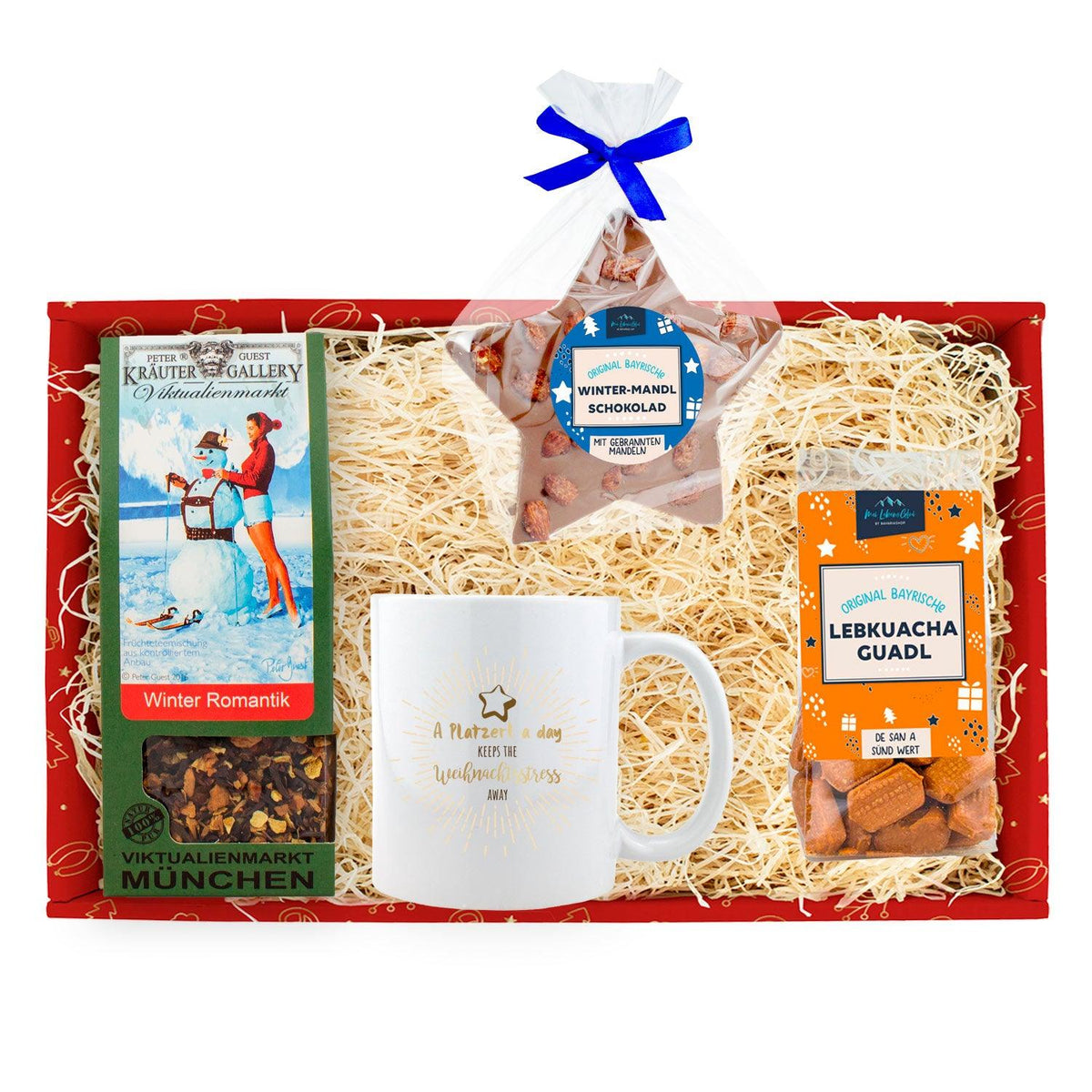 Weihnachtsbox "Weihnachtsfeier gmiatlich" mit Tee, Tasse, Lebkuchen und Winter-Mandel-Schokolade.