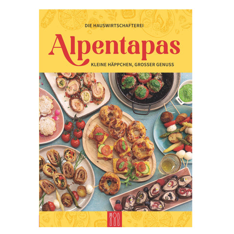 Kochbuch Alpentapas zeigt vielfältige Alpenküche mit kleinen Häppchen und Fingerfood auf mehreren Tellern.