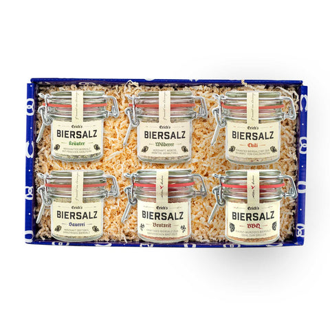 Geschenkbox mit sechs Gläsern Erichs Biersalz, diversen Sorten wie Kräuter, Chili und BBQ für vielseitigen Genuss.