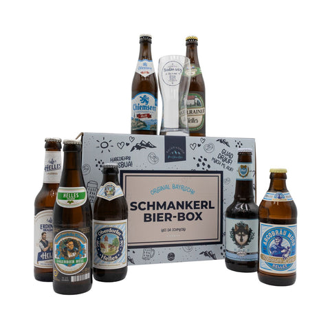 Bier-Box „Schmankerl“ mit bayerischen Bierflaschen und Verkostungsglas vor der Geschenkbox