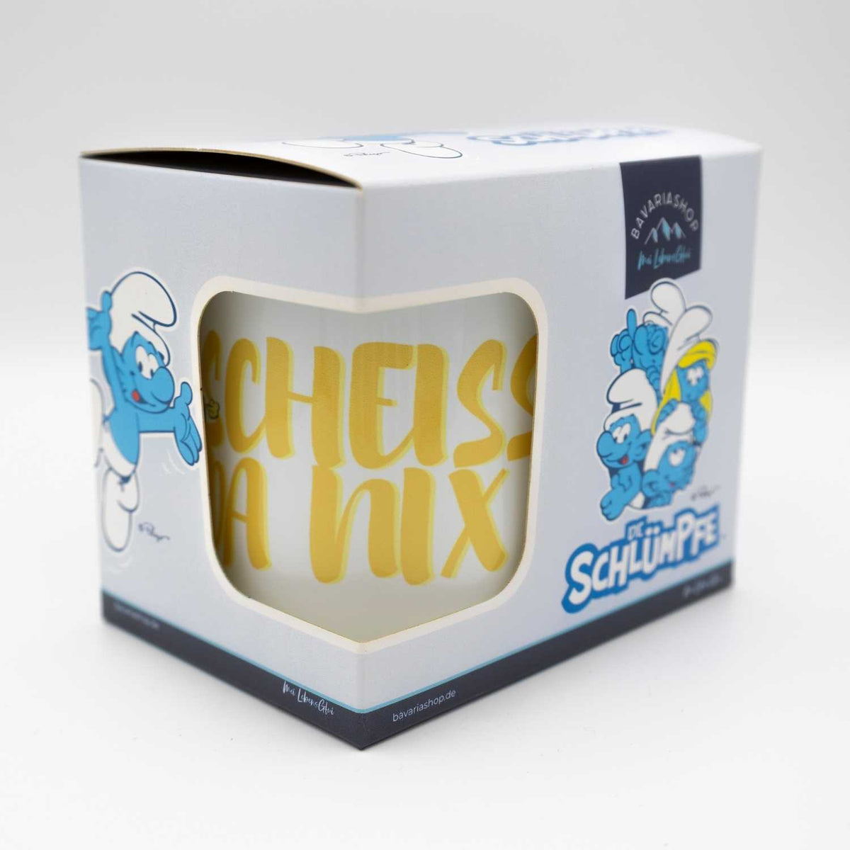 Weiße ®Die Schlümpfe Tasse Scheiß da nix mit goldener Aufschrift, in geöffneter Geschenkbox.