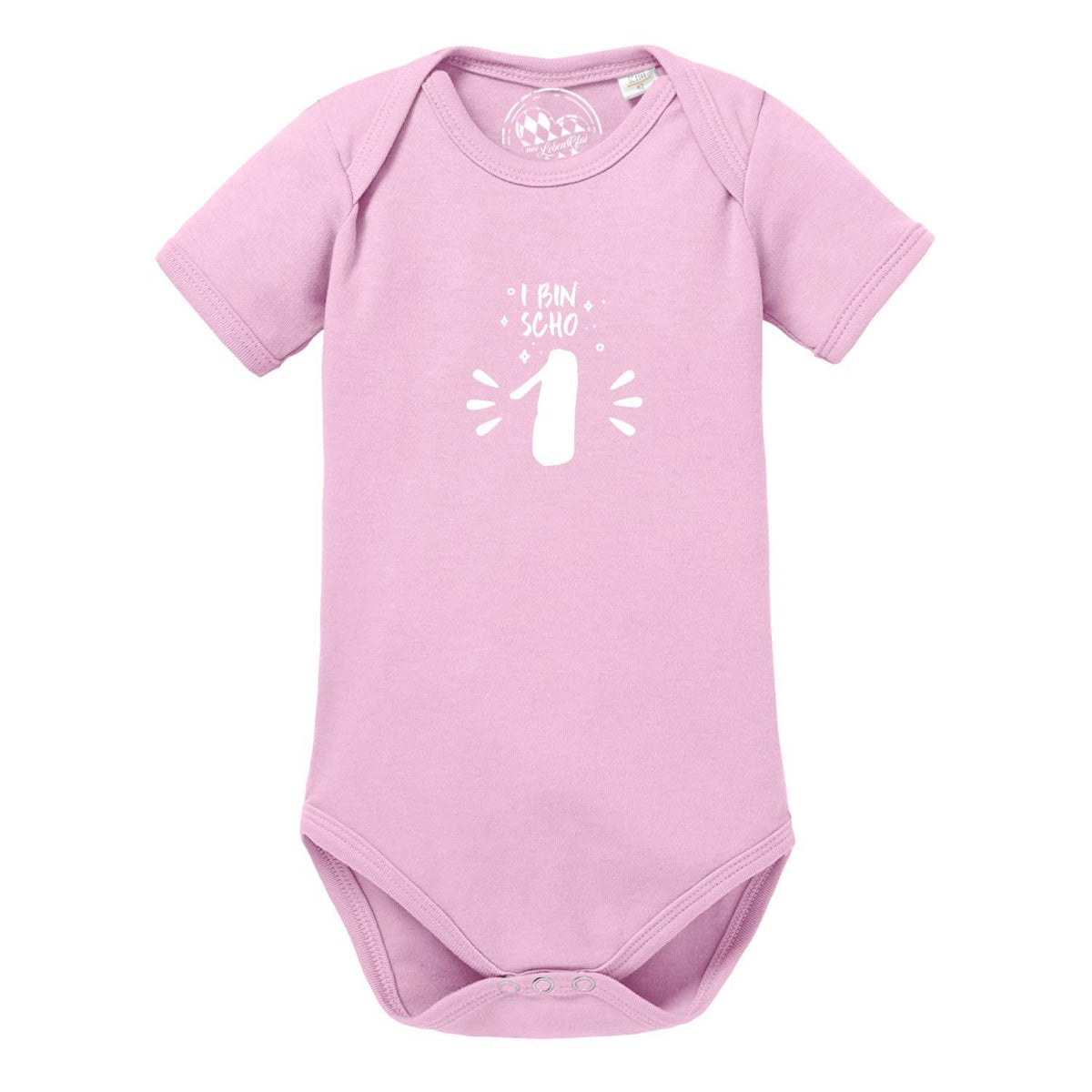 Rosa Baby Body "I bin scho 1!" mit weißem Aufdruck zum ersten Geburtstag, kurzärmlig aus Baumwolle.