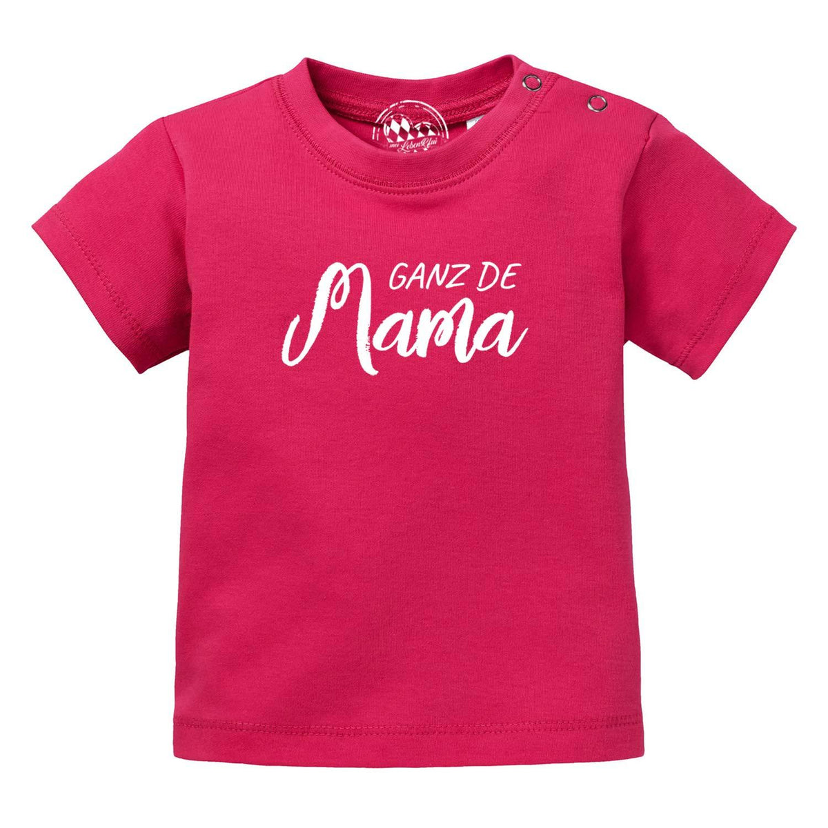Baby T-Shirt Ganz de Mama in Fuchsia mit weißem Schriftzug und Druckknöpfen an der Schulter, kurzärmlig.