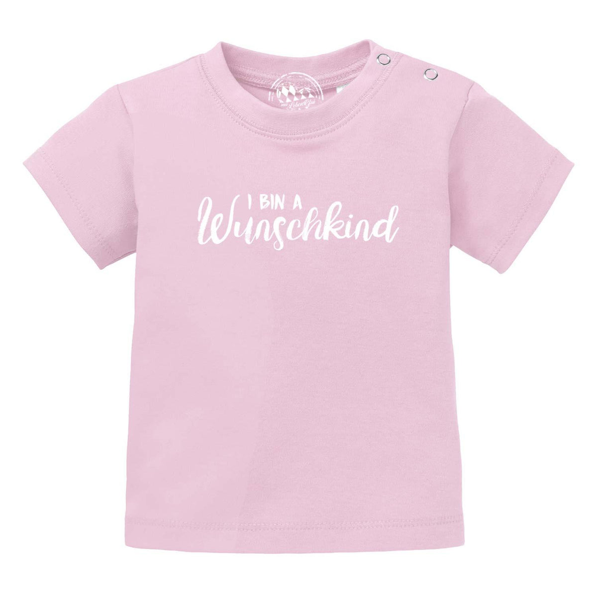Rosa Baby T-Shirt Wunschkind aus Baumwolle mit weißen Druckknöpfen an der Schulter und weißem Schriftzug.