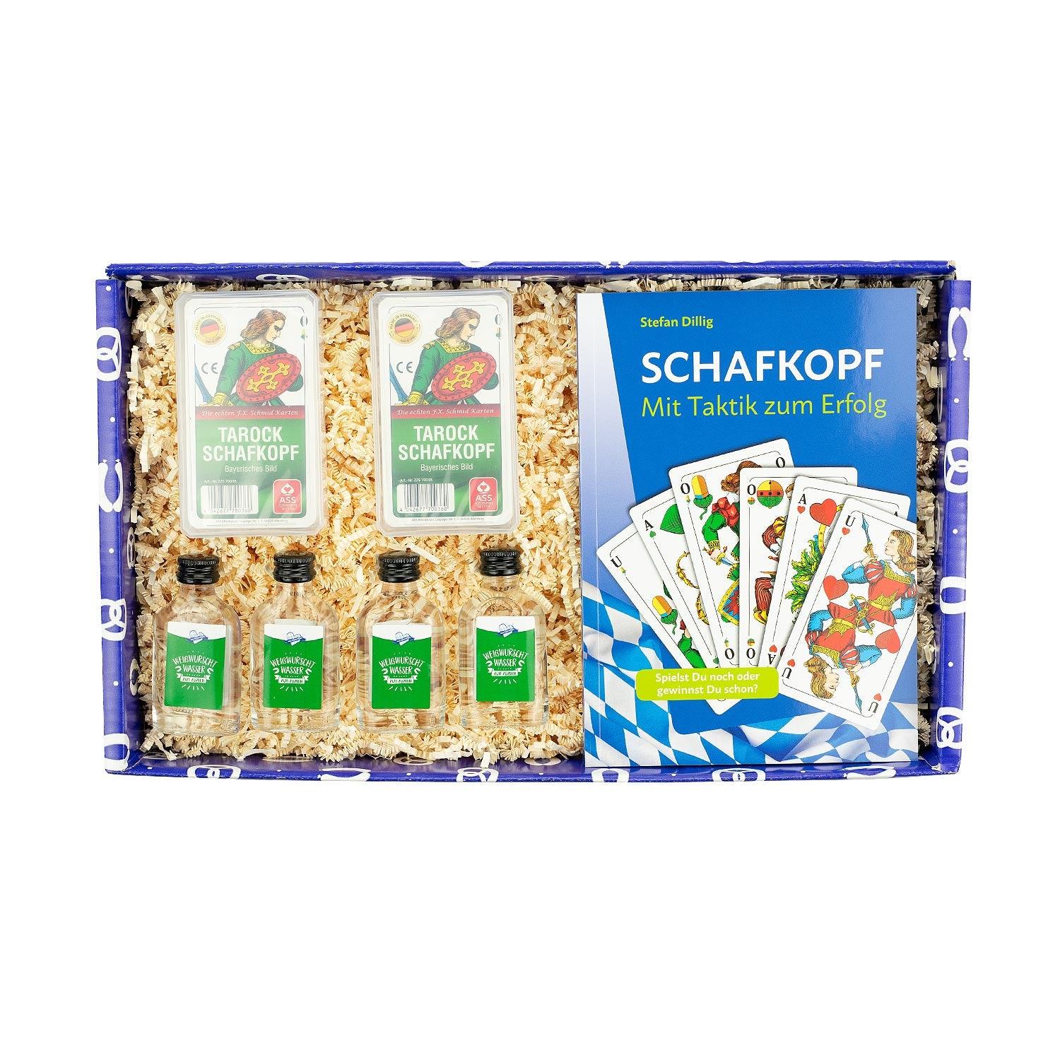 Geschenkbox Jeda konn Schofkopfn mit zwei Kartenspielen, Buch und vier "Weißwurscht Wasser" Fläschchen.