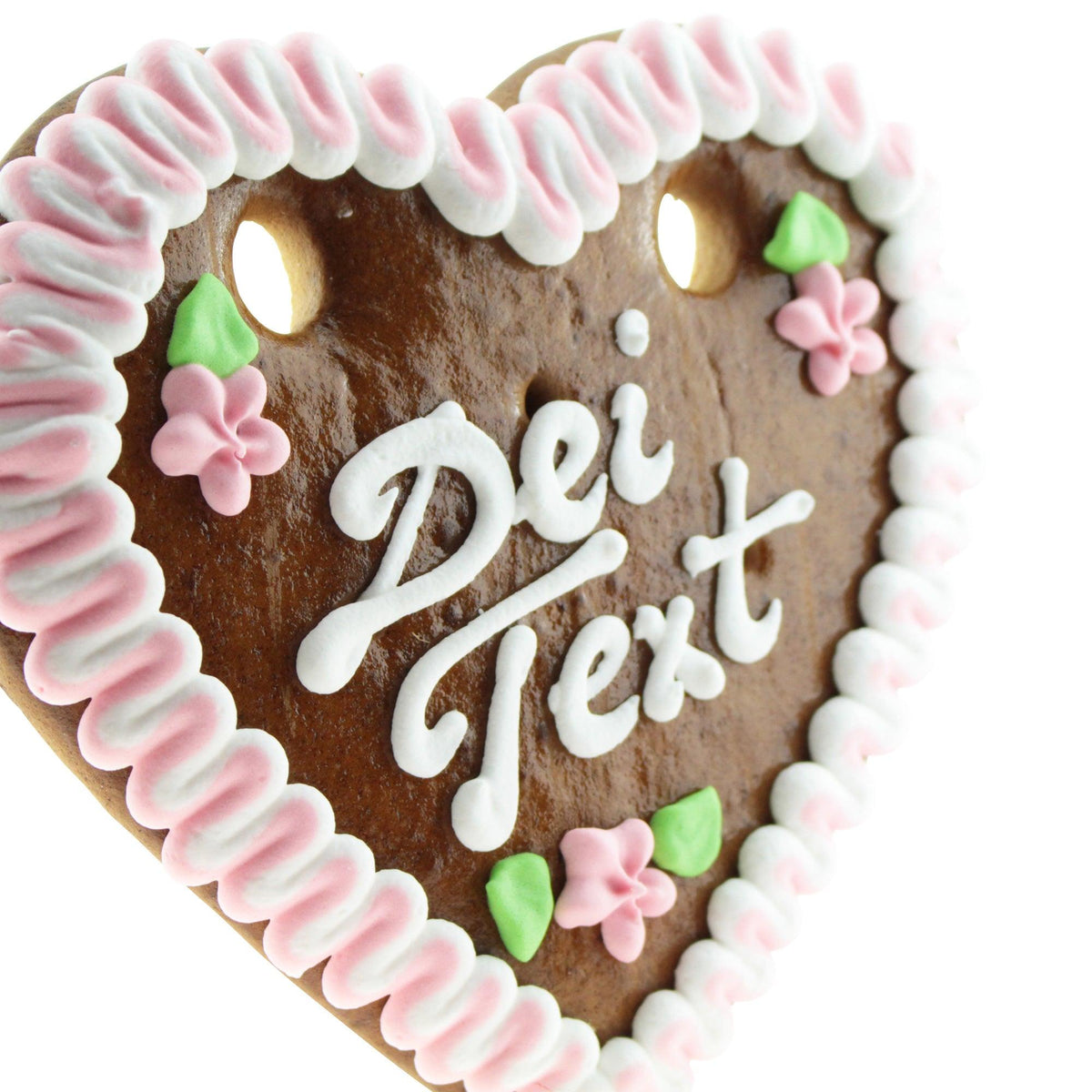 Braunes Lebkuchenherz mit weißer Zuckergussumrandung, rosa Blumen und grünem Blattdekor, dazu Schriftzug Deinen Text.